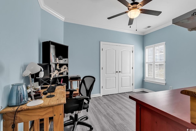 home office featuring crown molding, light hardwood / wood-style floors, and ceiling fan