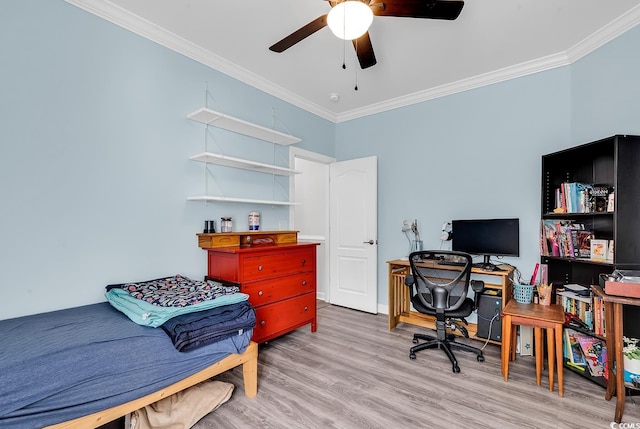 office space featuring light hardwood / wood-style flooring, ornamental molding, and ceiling fan