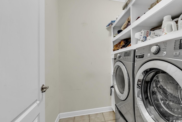 washroom featuring light tile patterned flooring and separate washer and dryer