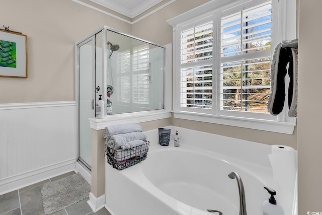 bathroom featuring crown molding, separate shower and tub, and a wealth of natural light