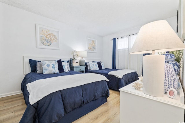 bedroom featuring light wood-type flooring