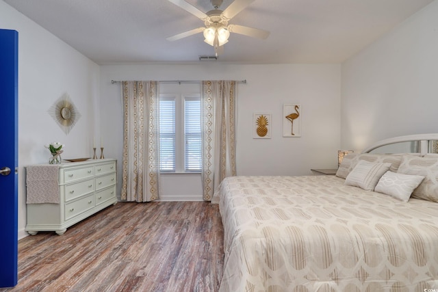 bedroom with hardwood / wood-style flooring and ceiling fan