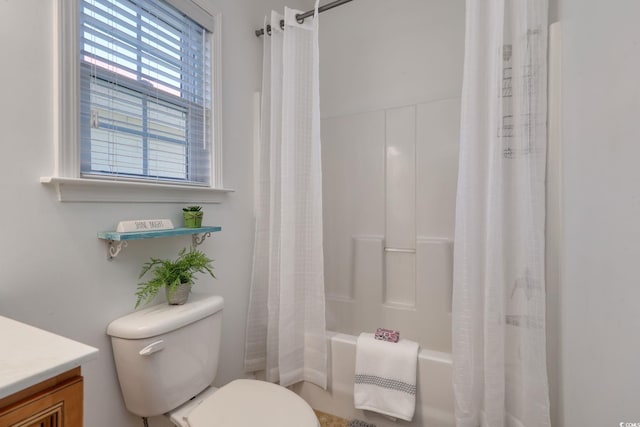 full bathroom featuring shower / tub combo, vanity, and toilet