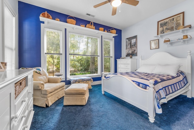 bedroom featuring dark colored carpet and ceiling fan