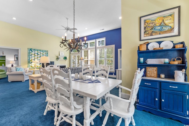 carpeted dining area featuring a chandelier