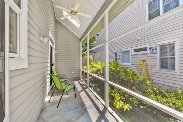 sunroom / solarium featuring vaulted ceiling and ceiling fan