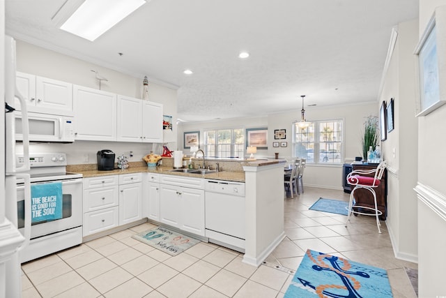 kitchen with white cabinetry, sink, kitchen peninsula, crown molding, and white appliances