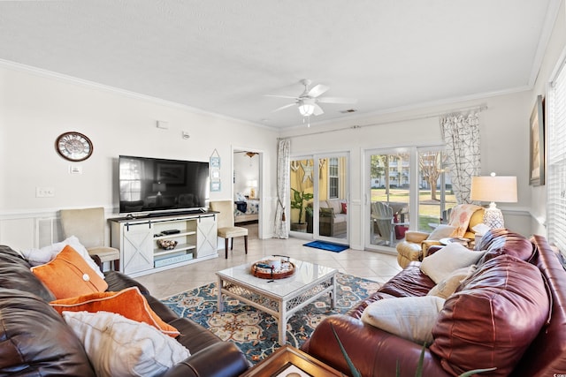 living room with crown molding, ceiling fan, a textured ceiling, and light tile patterned floors