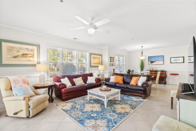 living room with ornamental molding, a healthy amount of sunlight, and light tile patterned floors