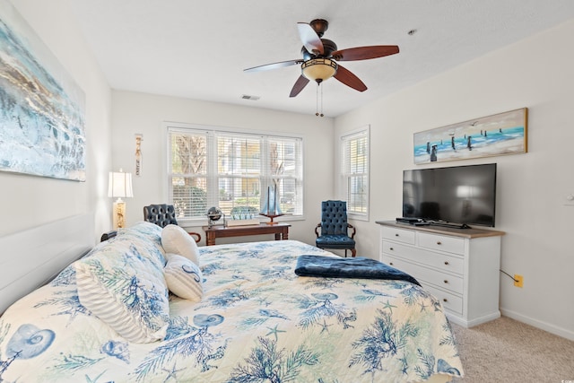 bedroom with ceiling fan and light colored carpet