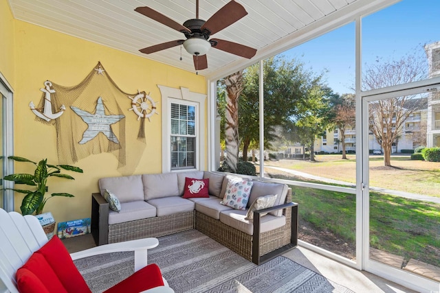 sunroom / solarium featuring wooden ceiling and ceiling fan