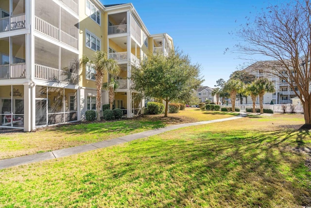 view of home's community featuring a yard