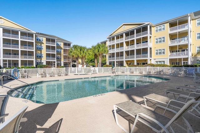 view of swimming pool featuring a patio area