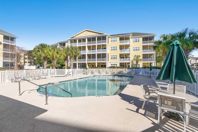 view of swimming pool featuring a patio