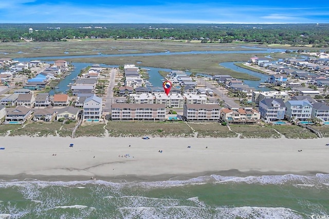 bird's eye view with a water view and a view of the beach