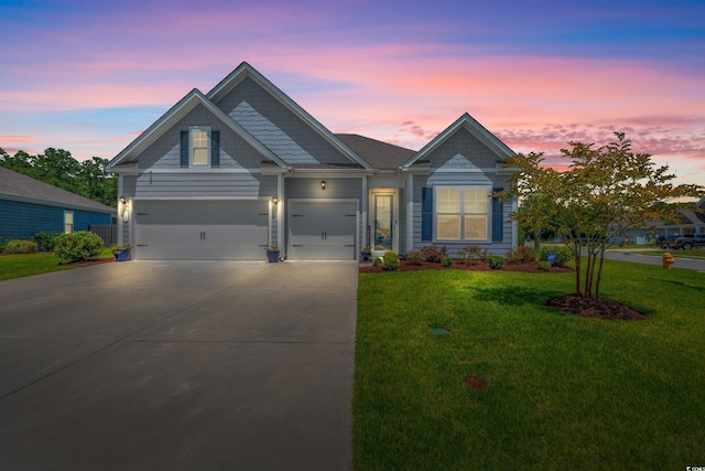 craftsman-style home with a garage and a lawn