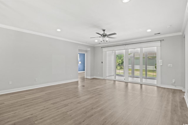 empty room featuring crown molding, ceiling fan, and light hardwood / wood-style floors