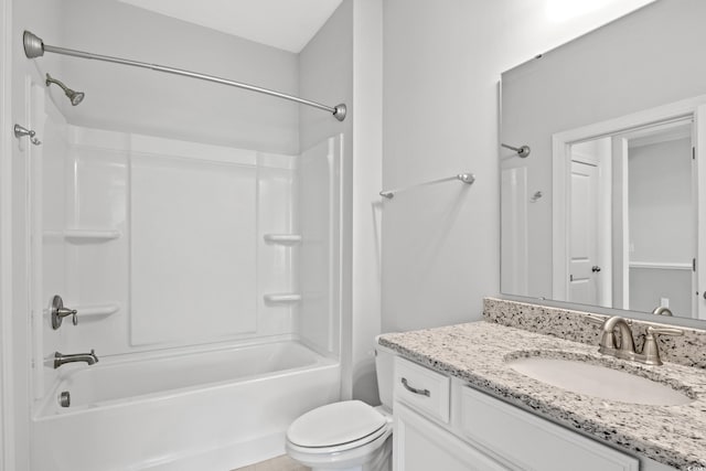 full bathroom with vanity, shower / tub combination, and toilet