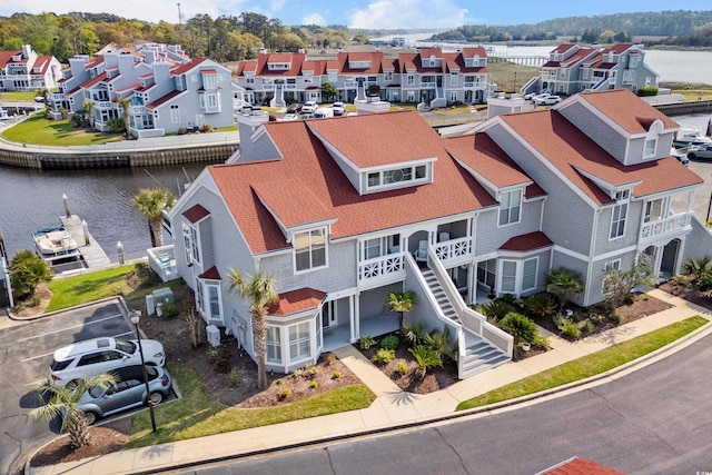 birds eye view of property with a water view