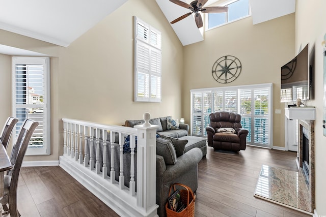 living room featuring ceiling fan, high vaulted ceiling, hardwood / wood-style floors, and a wealth of natural light