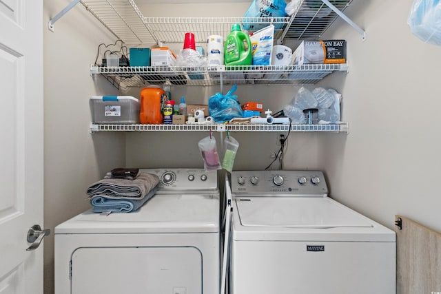 laundry area with separate washer and dryer