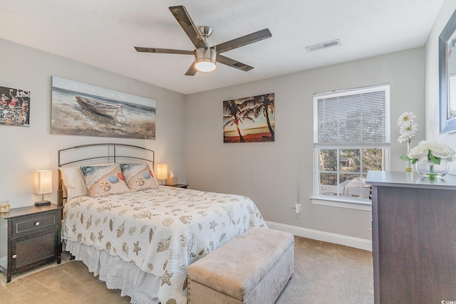 carpeted bedroom featuring ceiling fan