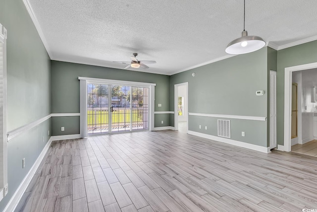 unfurnished room with ceiling fan, crown molding, a textured ceiling, and light wood-type flooring