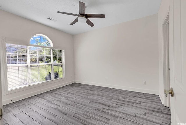 unfurnished room featuring ceiling fan and light hardwood / wood-style floors