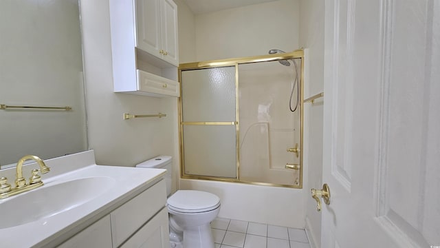 full bathroom featuring tile patterned flooring, vanity, enclosed tub / shower combo, and toilet