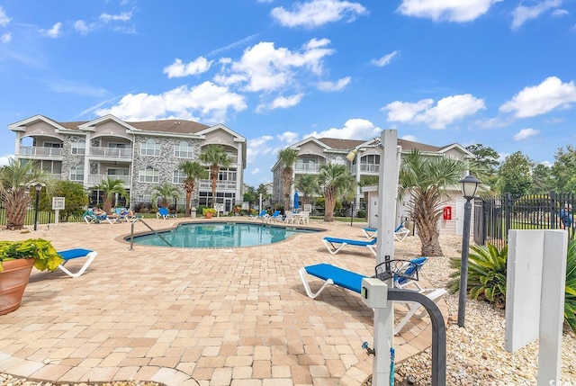 view of swimming pool featuring a patio area