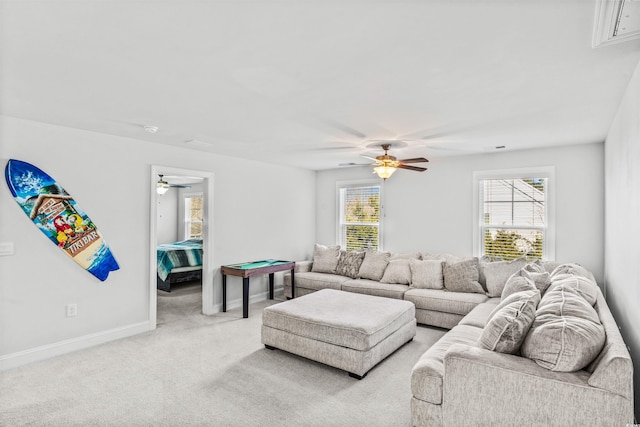 living room with carpet floors and ceiling fan