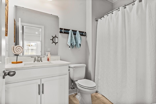 bathroom with vanity, toilet, and tile patterned flooring