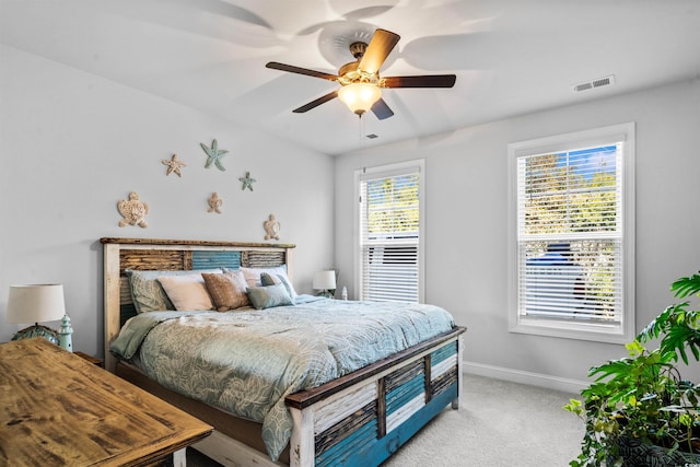 bedroom featuring ceiling fan and light carpet