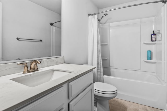 full bathroom with vanity, shower / bath combo, and toilet