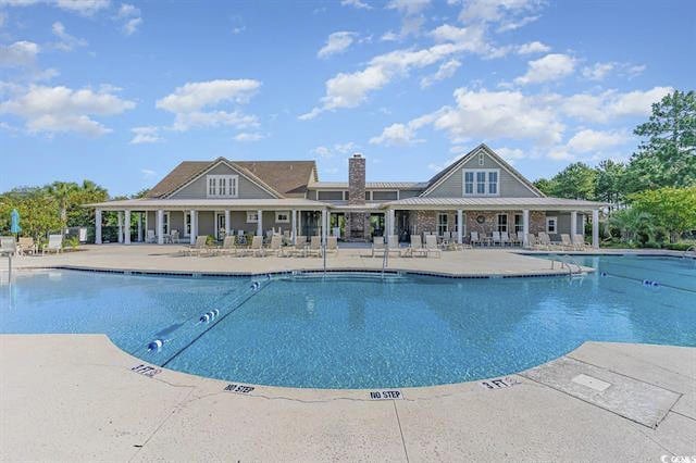 view of swimming pool with a patio area