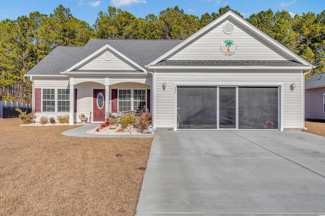 view of front of home featuring a garage and a front lawn