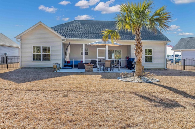 rear view of house featuring an outdoor living space and a patio