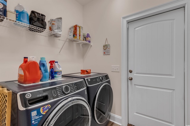 washroom featuring washing machine and dryer