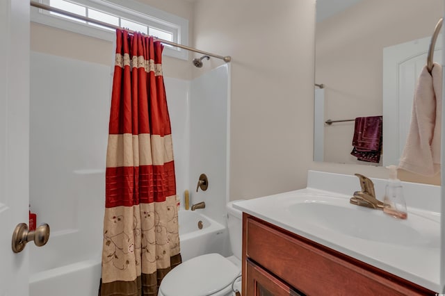 full bathroom featuring shower / tub combo with curtain, vanity, and toilet