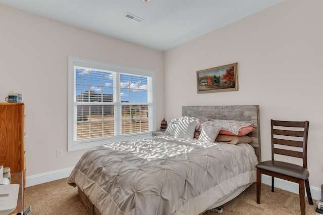 bedroom with light carpet