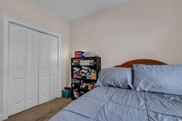 bedroom with a closet and carpet