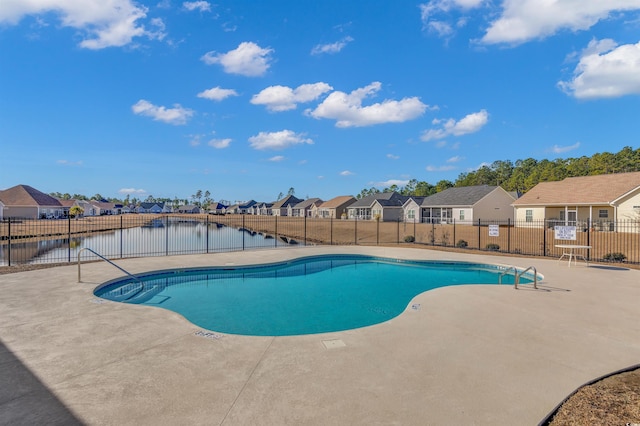 view of pool with a water view