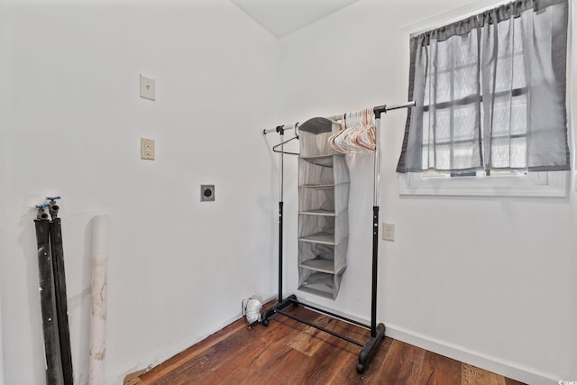 interior space featuring hookup for an electric dryer, dark hardwood / wood-style flooring, and hookup for a washing machine