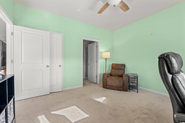 office space with light carpet and ceiling fan