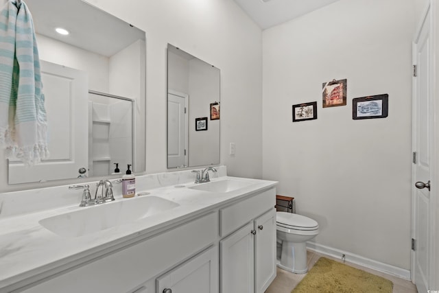 bathroom featuring tile patterned floors, vanity, and toilet