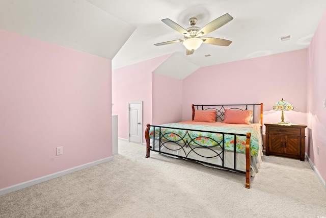 bedroom featuring ceiling fan, light colored carpet, and lofted ceiling