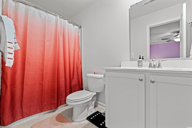 bathroom with vanity, curtained shower, tile patterned floors, and toilet