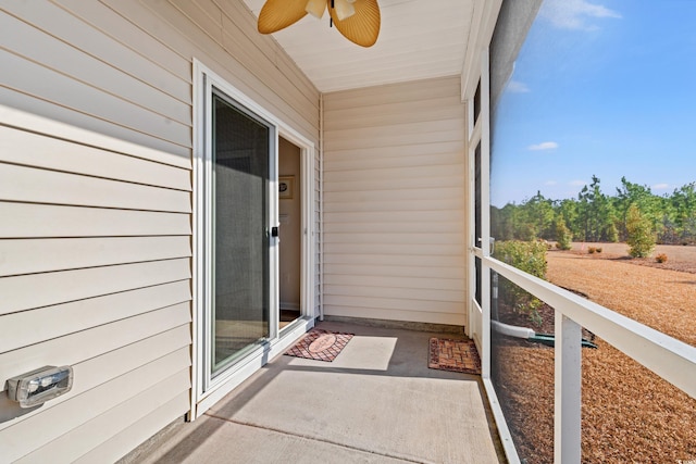 sunroom / solarium with ceiling fan