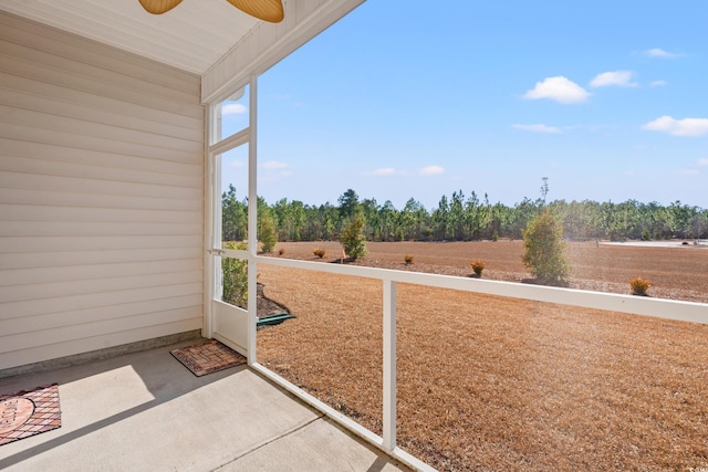 exterior space featuring ceiling fan