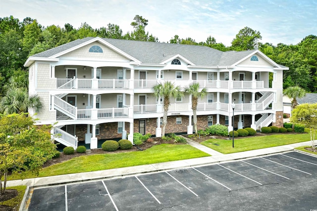 6015 Catalina Dr Unit 431, North Myrtle Beach, SC 29582 - view of property featuring uncovered parking and stairs